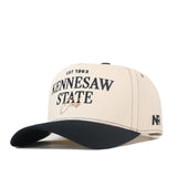 The Kennesaw State Owls Vintage Hat by No Rivals features a beige and black design, officially licensed EST 1963 Kennesaw State Owls embroidered logo on the front, NR branding on the side, and an adjustable snap back for a comfortable fit.