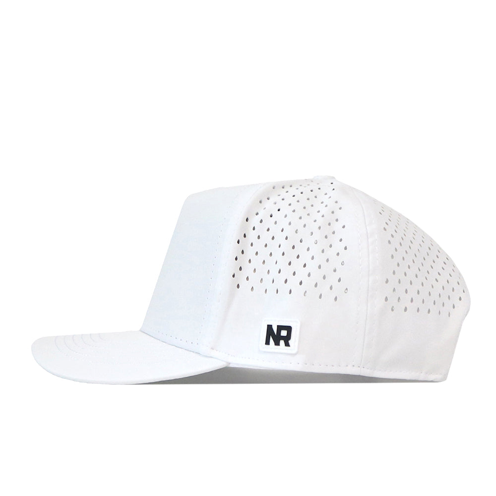 A white Purdue Golf Hat by No Rivals, featuring small ventilation holes on the sides and a black, officially licensed No Rivals embroidered logo patch on the front left panel. This snapback cap is displayed in profile against a white background.