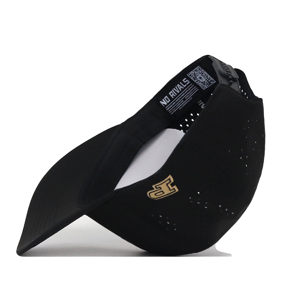The Purdue Golf Hat - Black by No Rivals features a gold embroidered logo on the side, vent holes, and a curved brim. Crafted for an ideal gameday fit, this hat offers a comfortable snap back adjustment. The inside label reads “NO RIVALS,” and a QR code is printed on the inner band.