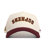 The No Rivals Minnesota Golden Gophers Upside Down Gophers Hat - Classic features a cream and maroon snapback design with “GOPHERS” embroidered upside down on the front in maroon and gold, making it an officially licensed standout for any fan.