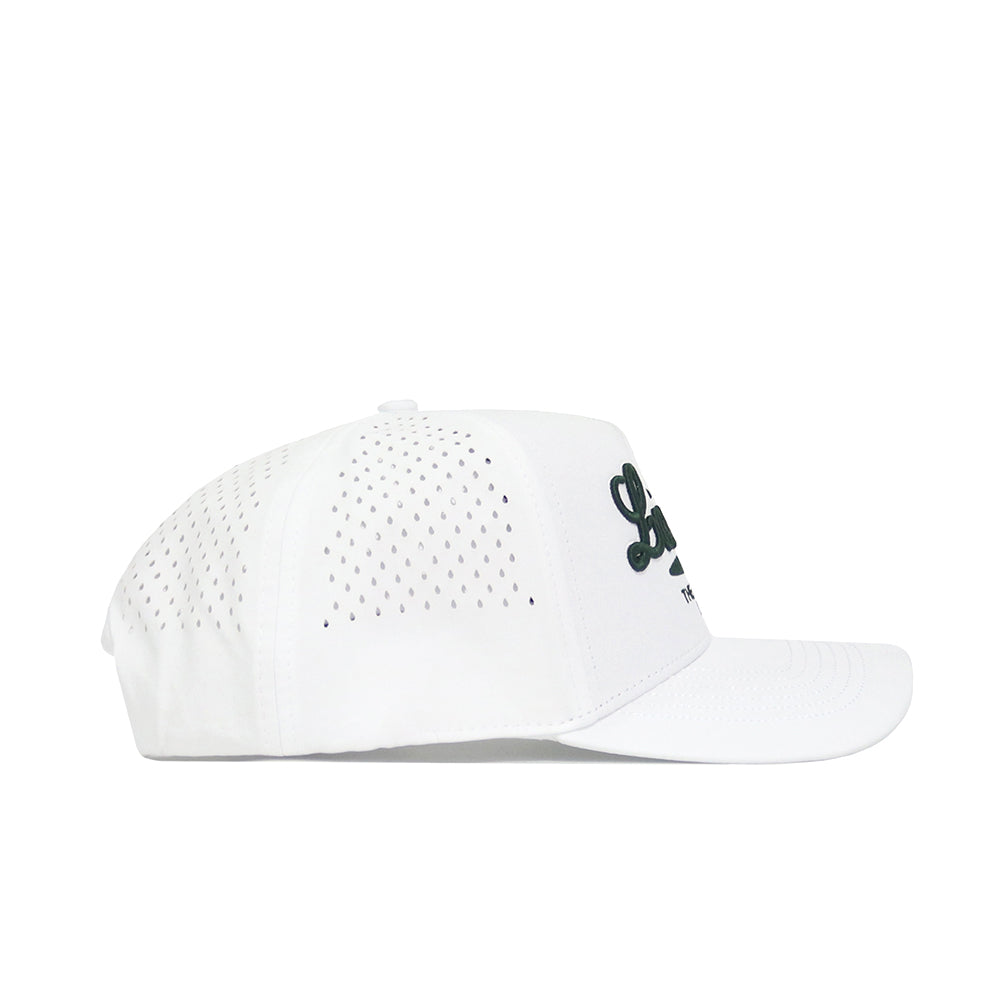 The Louisiana Clubhouse Hat by No Rivals is a white snapback featuring small side ventilation holes and black script on the front, crafted from a polyester-cotton blend. Shown in side profile against a white background.