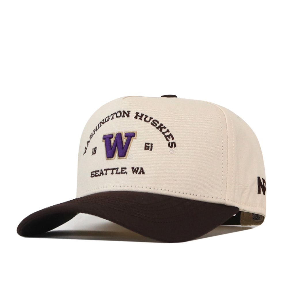 The No Rivals Washington Huskies Outlaw Hat - Classic is a cream and brown baseball cap featuring an officially licensed Washington Huskies design, “Seattle, WA,” and an embroidered purple “W” logo on the front. It includes a classic snap-back closure for adjustable comfort.
