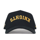 Show your team pride in style with the UCF Knights | Upside Down Knights Hat - Blackout by No Rivals. This officially licensed black snapback features “KNIGHTS” embroidered in gold upside down on the front.