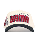 The Alabama Alma Mater Hat by No Rivals is a white snapback with a black brim, bold red BAMA lettering and CRIMSON TIDE above, part of a football helmet graphic on the left, and made from high-quality cotton in a structured fit.