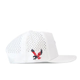 The EWU Golf Hat – White by No Rivals is displayed in profile. This performance fabric cap features large ventilation holes and a flat bill for enhanced comfort. On the side, a striking red and black embroidered eagle logo is featured, with wings spread and talons extended.
