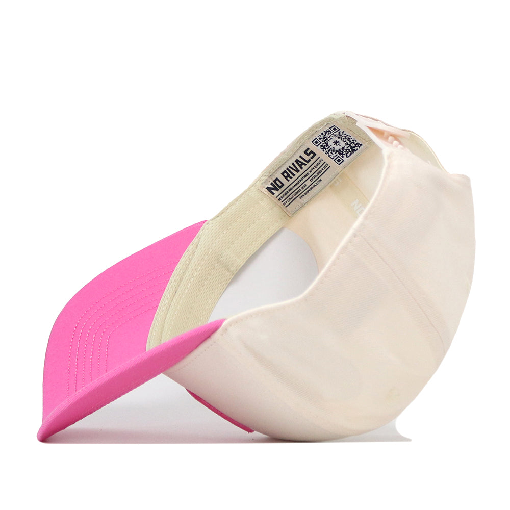 A Miami Pink Out Hat by No Rivals is shown upside down, revealing its interior label with the brand name. The bright pink brim and light beige body make this snap back baseball cap a standout choice for anyone seeking a stylish breast cancer hat.