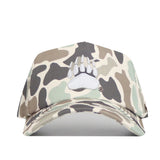 The No Rivals Montana Huntsman Hat is a Duck Camo 5-panel cap with an embroidered white bear paw print logo on the front, shown against a white background.
