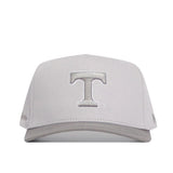 The No Rivals Tennessee Graphite Hat features a structured, light gray design with a large raised silver T embroidered on the front, a curved brim, and clean embroidered graphics for a simple, stylish look.