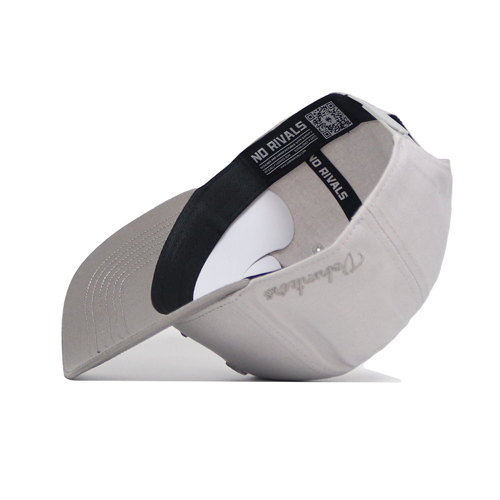 A Tennessee Graphite Hat by No Rivals, shown upside down to reveal a black band with a NO RIVALS label and QR code. Features gray NoRivals embroidery on the brim and an adjustable snapback closure.
