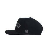 The No Rivals Tennessee Night Mode Hat is a black snapback shown in profile, with raised white "SEE" embroidery on the side and "NR" near the adjustable strap. It features a structured fit for lasting style.