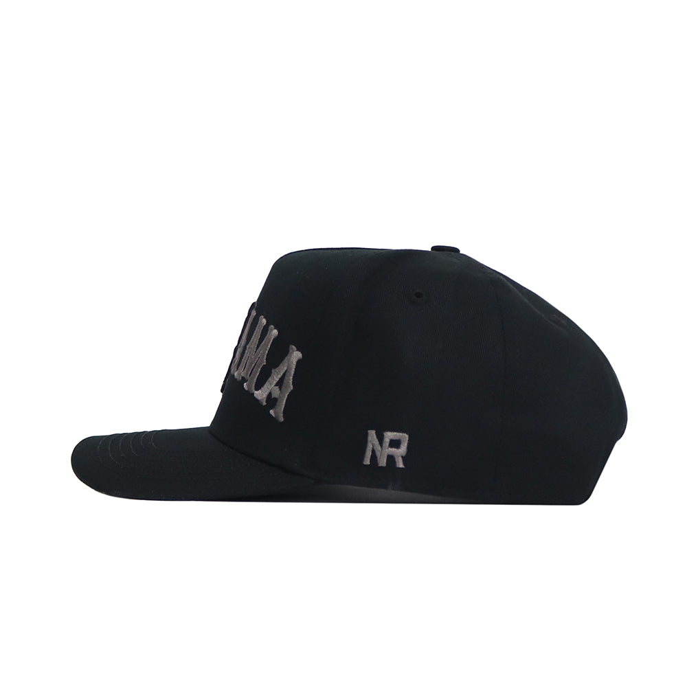 The Alabama Night Mode Hat by No Rivals is a black structured fit cap in a side view, made from high-quality cotton, featuring gray embroidered text on the front and NR stitched on the side.