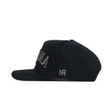 The Alabama Night Mode Hat by No Rivals is a black structured fit cap in a side view, made from high-quality cotton, featuring gray embroidered text on the front and NR stitched on the side.