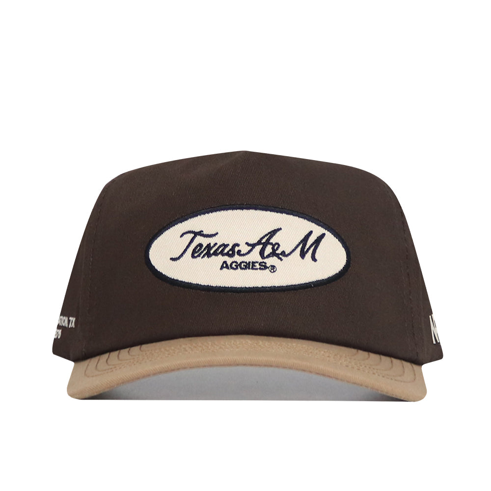 Front view of the Texas A&M Neutral Patch Hat by No Rivals, a brown and tan snapback with a white oval patch reading Texas A&M Aggies®. This officially licensed structured cap offers lasting style and comfort.