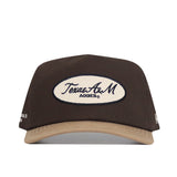 Front view of the Texas A&M Neutral Patch Hat by No Rivals, a brown and tan snapback with a white oval patch reading Texas A&M Aggies®. This officially licensed structured cap offers lasting style and comfort.