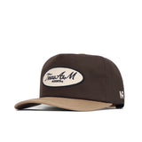The Texas A&M Neutral Patch Hat by No Rivals is a brown and beige snapback with an oval front patch reading "Texas A&M Aggies," white A and R letters on the side, and a structured, officially licensed fit for comfort and style.