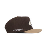 The No Rivals Tennessee Neutral Patch Hat is a brown corduroy hat with a tan brim, white oval patch, “Knoxville, Tennessee Est. 1794” embroidery, and a classic snapback closure.