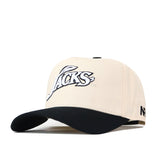 A beige South Dakota State Espresso Hat by No Rivals features a black brim and an embroidered “JACKS” logo in white and black on the front. Perfect for your gameday fit, the stylish snapback also displays the letters “NP” stitched in black on the left side.