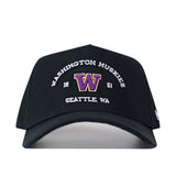 The No Rivals Washington Huskies Outlaw Hat - Black is an officially licensed snapback featuring "Washington Huskies Seattle, WA" and "1861" embroidered in white, along with a bold purple and gold W logo on the front. This stylish hat combines classic design with team pride, making it perfect for any fan.