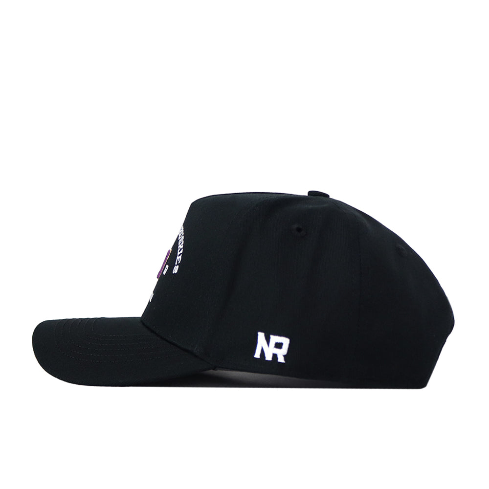 A side view of the No Rivals Washington Huskies Outlaw Hat in black, featuring an officially licensed white embroidered NR logo on the back panel. The cap includes a curved brim and visible stitching.