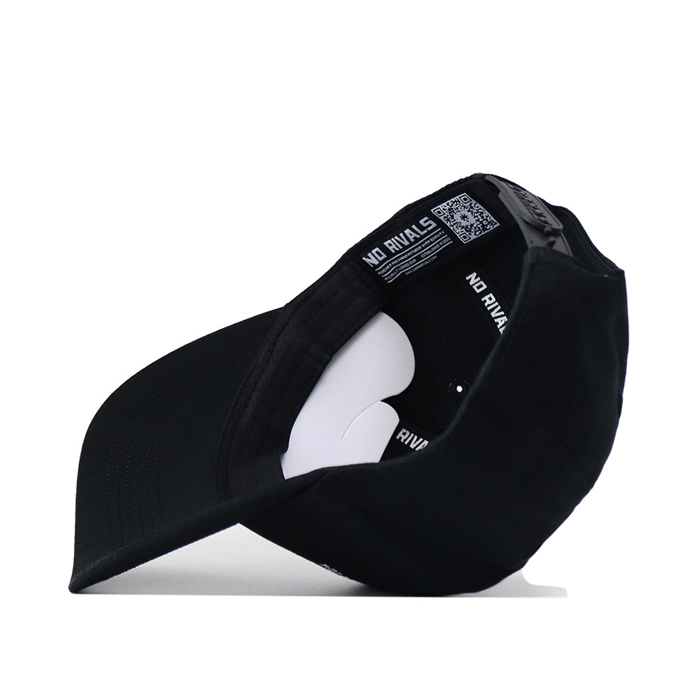 A black Washington Huskies Outlaw Hat by No Rivals is shown from the inside, revealing the inner labels and stitching. The words "NO RIVALS" are visible on the inner band, and a curved white insert helps shape the crown of this officially licensed snapback hat.