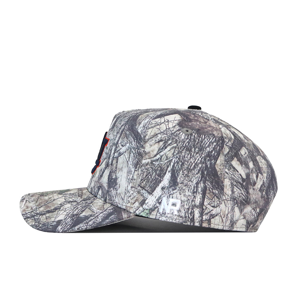 A side view of the Auburn Outland Hat, a camouflage-patterned snapback baseball cap with a flat bill by No Rivals. This officially licensed cap features a white embroidered AR logo near the back.