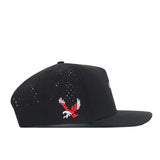 The EWU Golf Hat - Black by No Rivals is a black snapback hat made from performance fabric, featuring ventilation holes and an embroidered red and white eagle logo on the side.