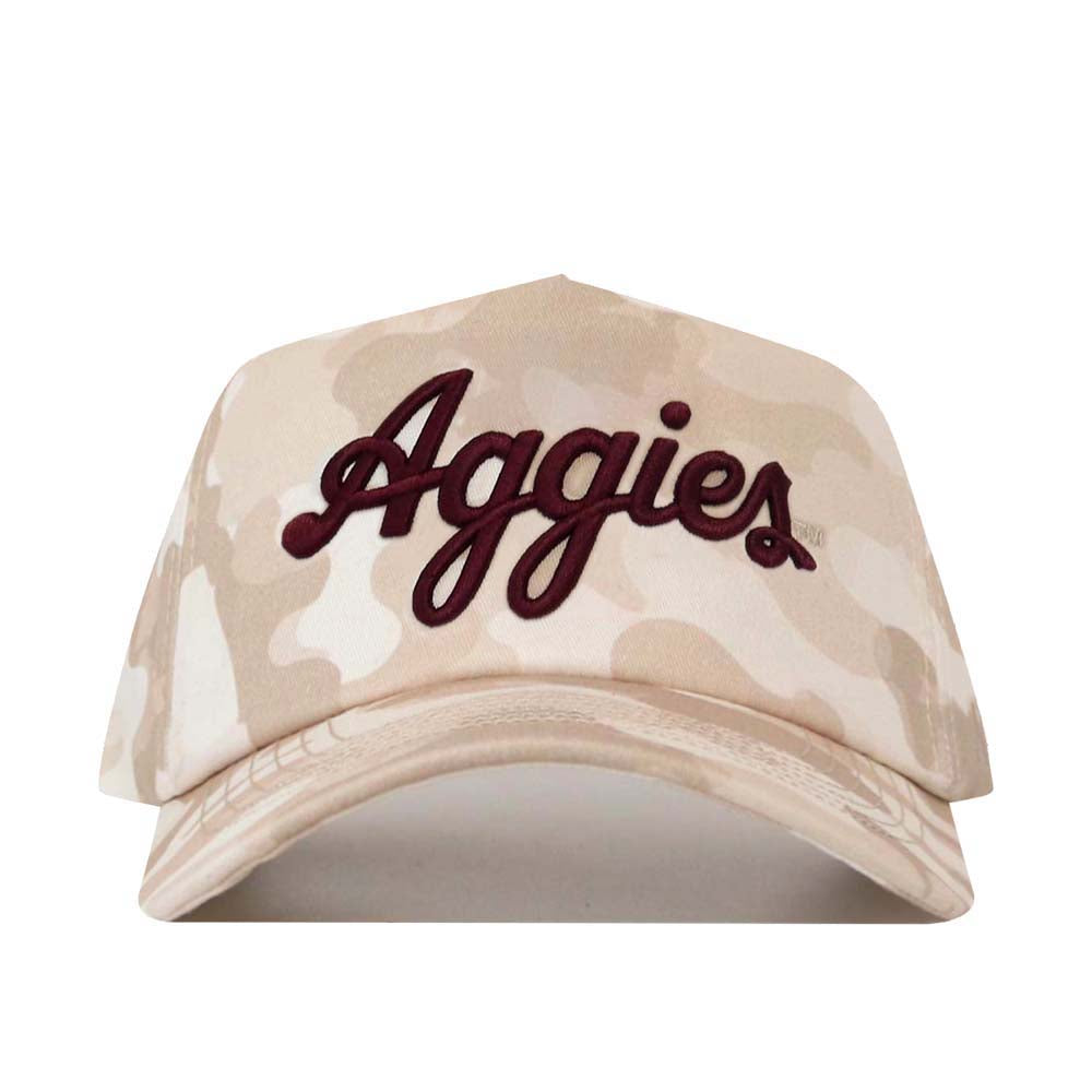 The No Rivals Texas A&M Script Sand Camo Hat - Unstructured is a beige camouflage baseball cap crafted from high-quality cotton, showcasing “Aggies” embroidered in dark red cursive on the front and finished with a convenient snap-back closure.