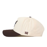 A cream-colored snap back hat with a brown brim, the Minnesota State University Mankato Espresso Hat by No Rivals is shown from the side. An embroidered NR logo in brown decorates the side panel near the back, making it a standout addition to any gameday fit.