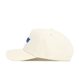 The No Rivals Kentucky Sideline Hat is a cream-colored cap with blue embroidery on the front and "NR" in white on the side. Shown in a side profile against a white background, it features a structured fit.