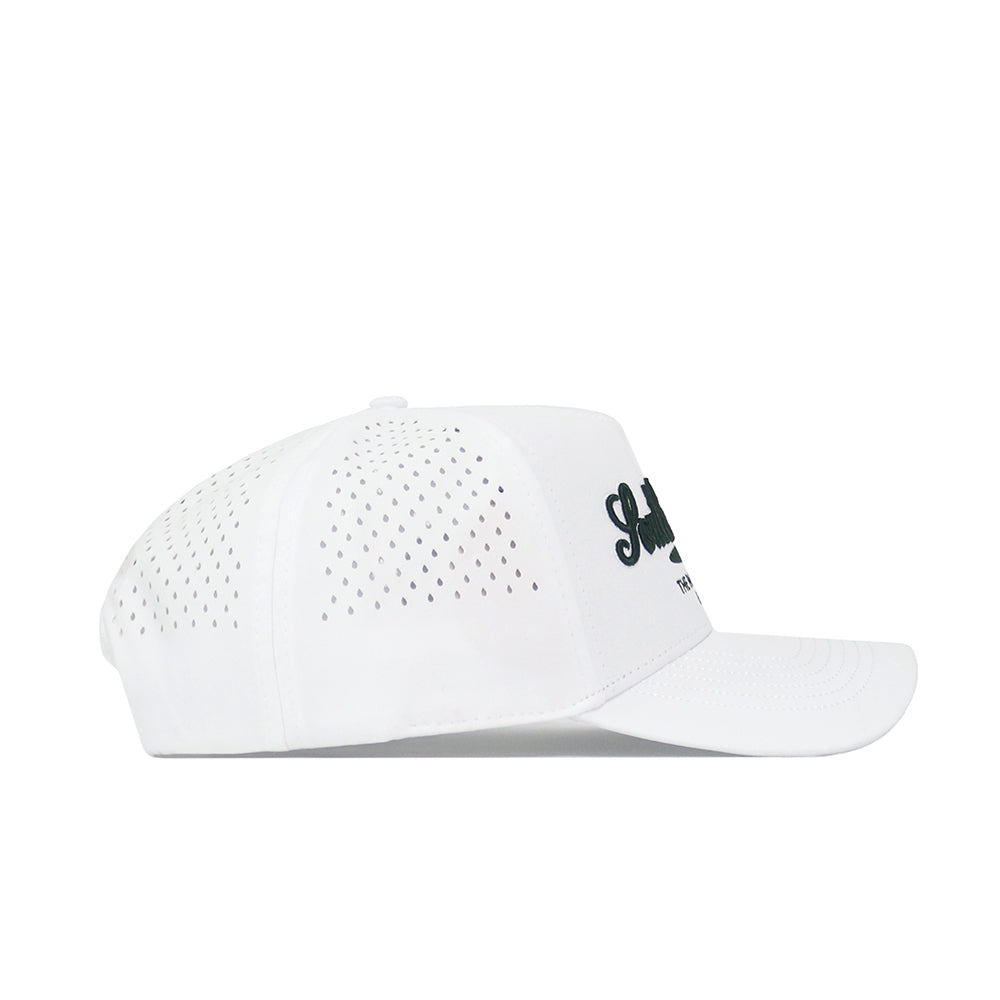 The South Carolina Clubhouse Hat by No Rivals is a white structured-fit cap with black embroidered text on the front, made from a polyester-cotton blend and has side and back ventilation holes. Shown here in a side view.