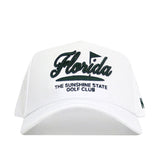 The No Rivals Florida Clubhouse Hat is a white structured fit made from a polyester-cotton blend, with black embroidery reading "Florida" above "THE SUNSHINE STATE GOLF CLUB" and a small flag detail above the text.