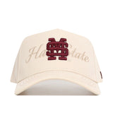 The No Rivals Mississippi State Stacked Hat is a cream baseball cap with a maroon MS logo and "Hail State" embroidered on the front, made from high-quality cotton with a structured, comfortable fit.