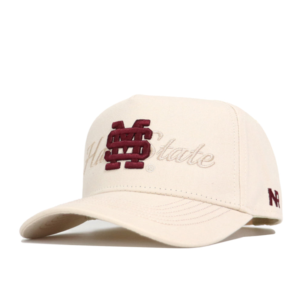 The No Rivals Mississippi State Stacked Hat is a beige, structured cotton cap with a maroon MS logo embroidered on the front, "State" in beige script behind it, and a small maroon N logo on the side.