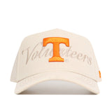 The No Rivals Tennessee Stacked Hat is a cream snapback made of high-quality cotton, with an orange T and "Volunteers" embroidered in beige script on the structured front.