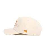 The No Rivals Tennessee Stacked Hat is a cream snapback made from high-quality cotton, with orange embroidered NR letters on the side and partially visible text on the front, shown against a white background.