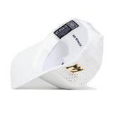 The white ETSU Golfing Buc Hat by No Rivals is displayed on its side, featuring a black and gold M logo on the front, "NO RIVALS" printed inside, ventilation holes, and an adjustable snapback. Officially licensed.