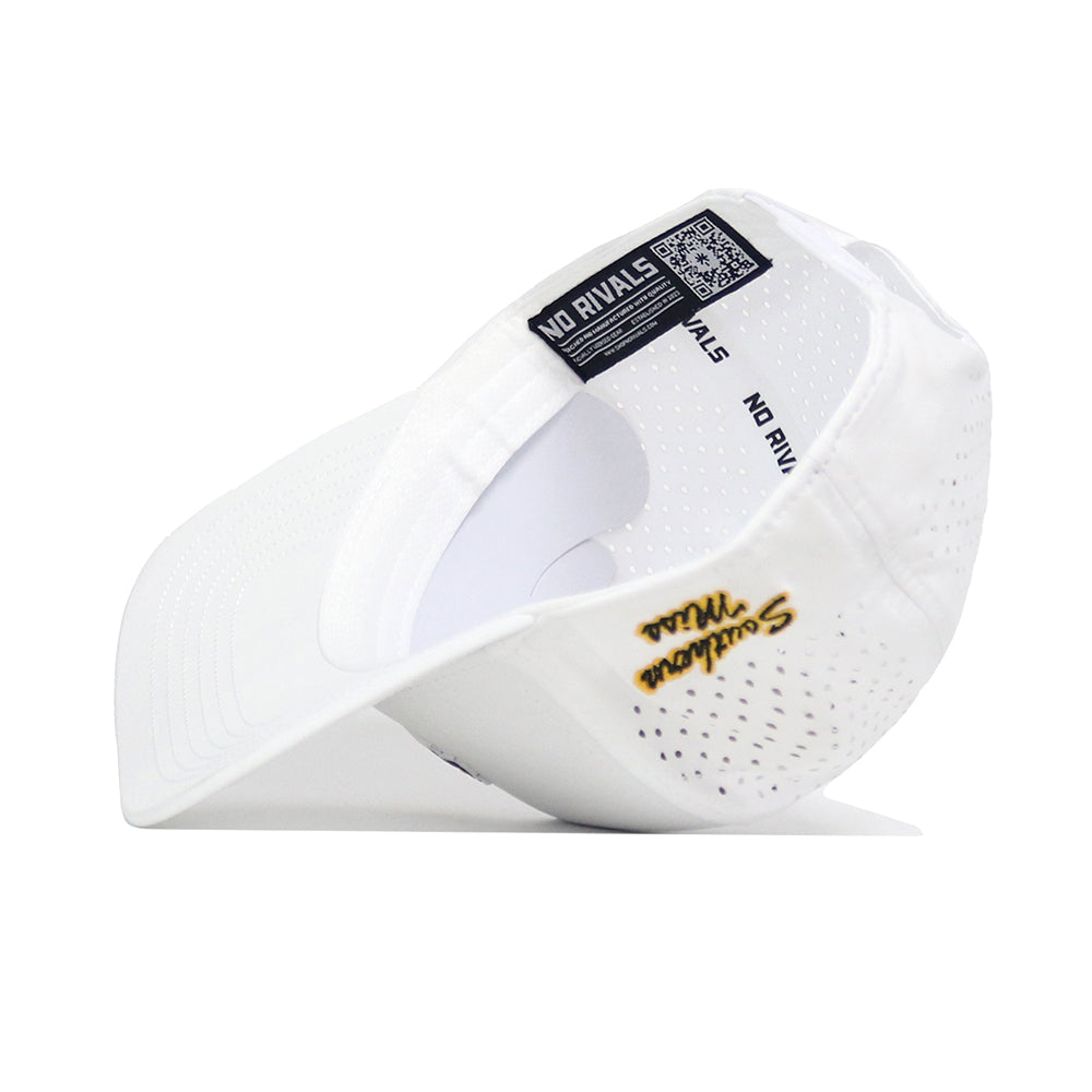The Southern Miss Golf Hat - White by No Rivals is shown upside down, revealing its inside tags with the brand name and a QR code. It features an embroidered logo, gold Soulion Will details, ventilation holes, and an adjustable snap back for a perfect fit.