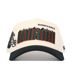 The Miami Hurricanes Alma Mater Hat is a white and black snapback baseball cap featuring "MIAMI" in bold green and orange, "HURRICANES" above it, a football helmet graphic on the left side, and durable high-quality cotton construction.