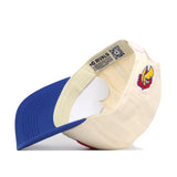 The Kansas Jayhawks Stadium Hat by No Rivals is displayed upside down, revealing interior tags. This cap features a structured cream crown, a curved blue bill, and an adjustable snap back for a perfect fit. The exterior is adorned with a colorful embroidered Jayhawks bird logo on the side.