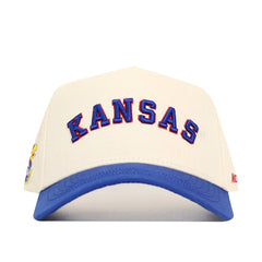 The No Rivals Right Side Up KANSAS Hat features bold blue and red embroidery on the front, a white snap back design with a blue brim, and is made from high-quality cotton. Official Kansas Jayhawks classic colors.