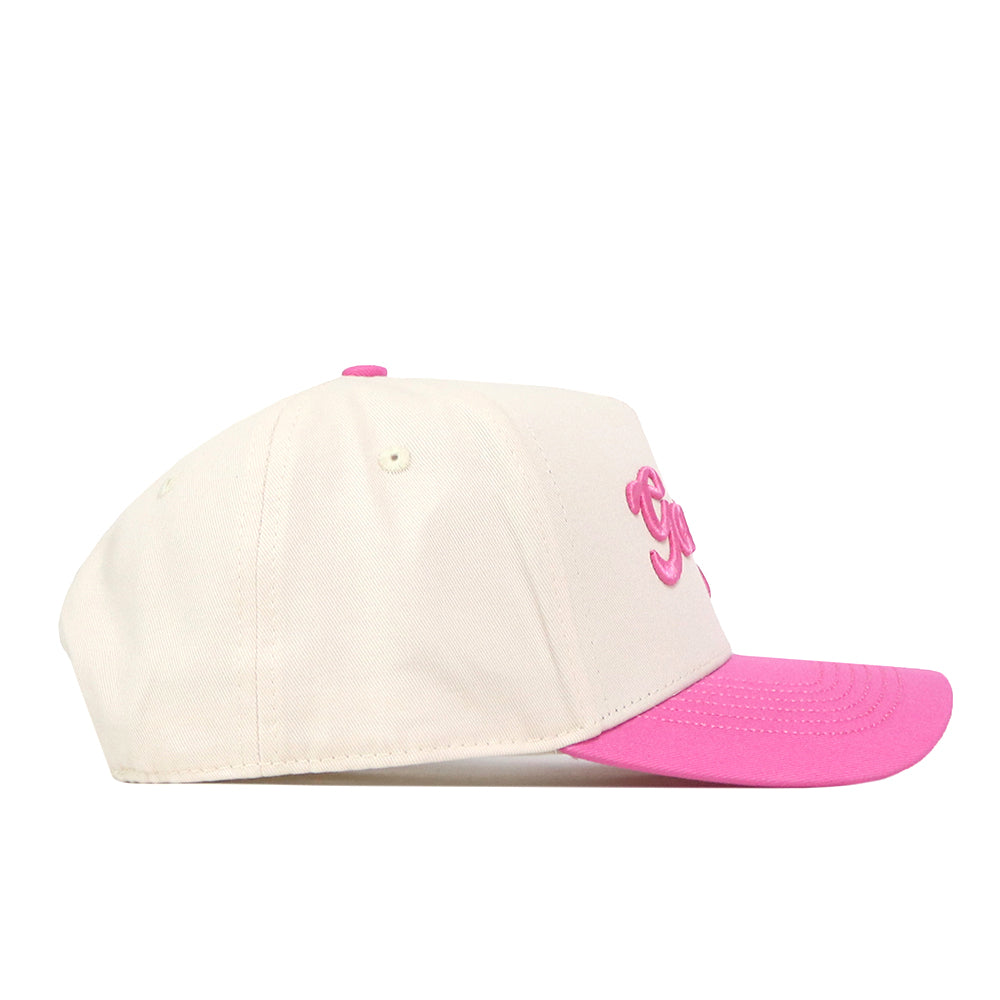 The No Rivals Georgia Pink Out Hat is a white snapback baseball cap featuring a vibrant pink brim. Shown from the side, the front panel displays partially visible pink embroidered lettering, making this hat a stylish way to show your support for the National Breast Cancer Foundation.