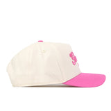 The No Rivals Georgia Pink Out Hat is a white snapback baseball cap featuring a vibrant pink brim. Shown from the side, the front panel displays partially visible pink embroidered lettering, making this hat a stylish way to show your support for the National Breast Cancer Foundation.