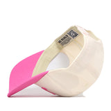 The No Rivals Texas Pink Out Hat is pictured upside down, showcasing its interior details such as the label and stitching. This officially licensed cap features a curved pink brim, a cream crown, and an adjustable snap back closure for a comfortable fit.