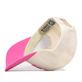 The No Rivals Dallas Pink Out Hat is turned inside out, revealing its inner labels and stitching. The brim is pink while the rest of the hat is white. This officially licensed cap also features a convenient snap back adjustment for a comfortable fit.