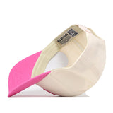 The Utah Pink Out Hat by No Rivals is pictured upside down, revealing its inside label and showcasing a bold snapback design featuring a vibrant pink brim and a cream-colored crown for both comfort and standout style.