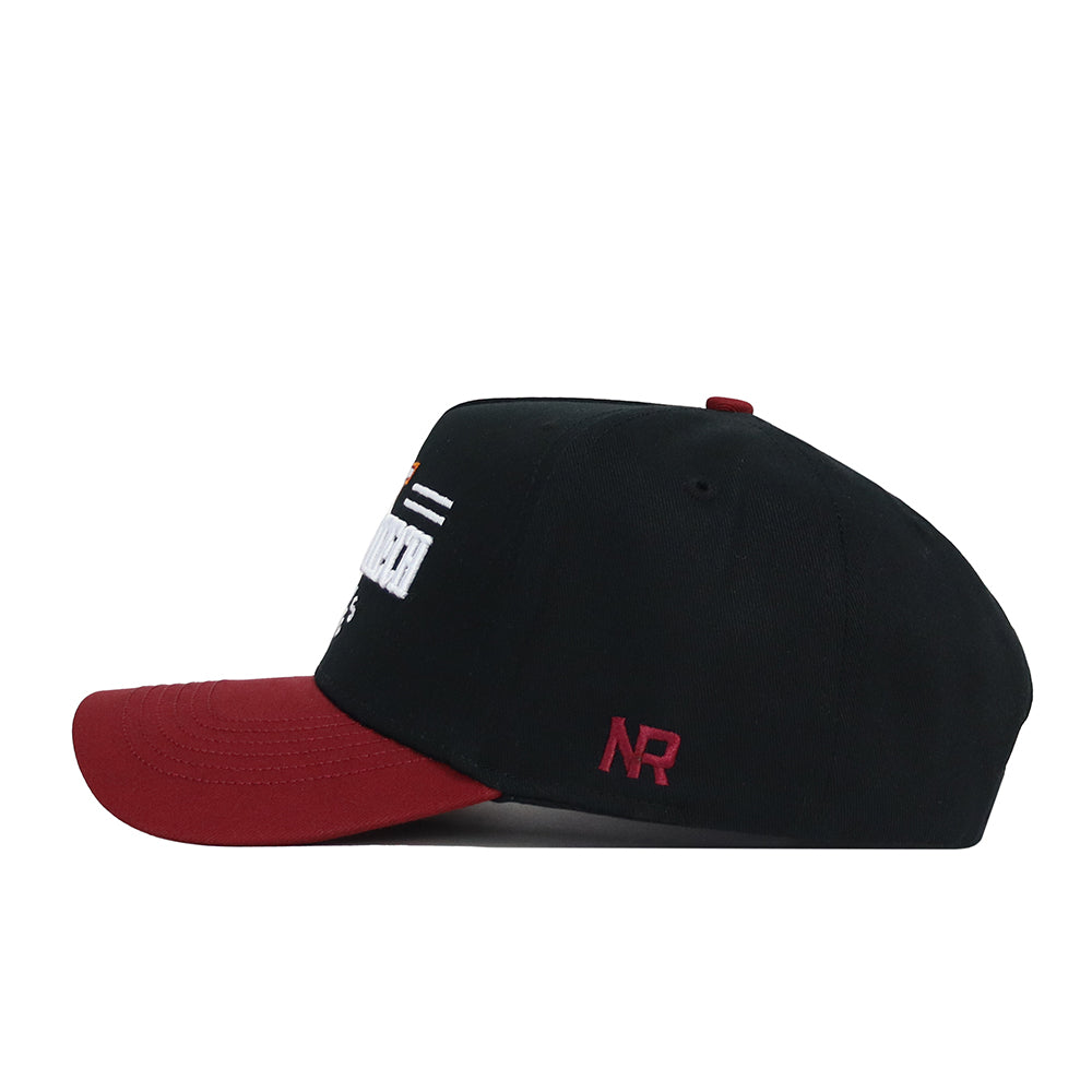 The Virginia Tech Tailgate Hat by No Rivals is a black snapback with a maroon brim, shown from the side. "NR" is embroidered in maroon on the side, with partial white text and small designs visible on the structured front.