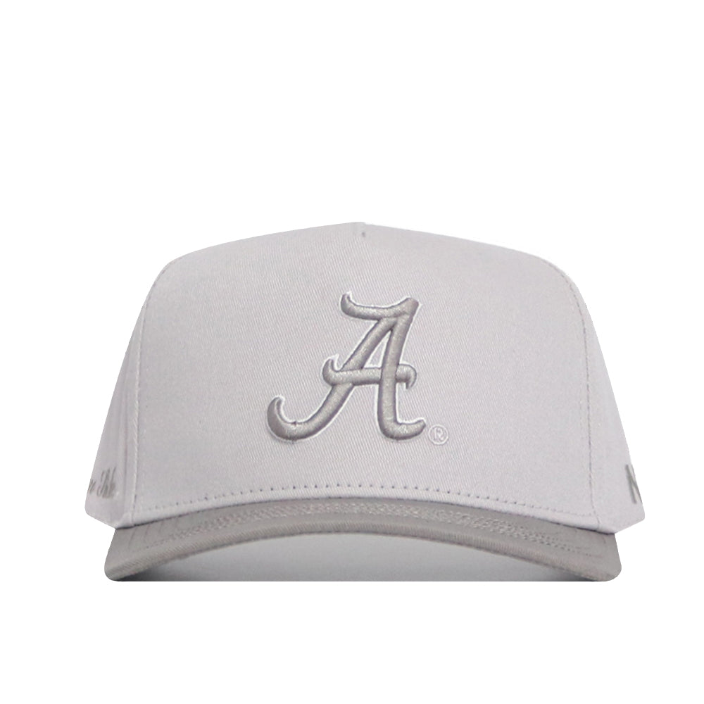 The Alabama Graphite Hat by No Rivals is a light gray structured cap with a curved brim, silver embroidered A logo on the front, smaller side logo, and an adjustable snapback closure for comfort.