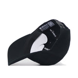 The Virginia Tech Outlaw Hat - Black by No Rivals is pictured upside down to showcase the interior detailing. The inner band features the repeated “NO RIVALS” branding, and a QR code is located on the label near the back strap. With its snap back adjustment for a secure gameday fit, this hat delivers both comfort and style—perfect whether you’re cheering from the stands or out and about.