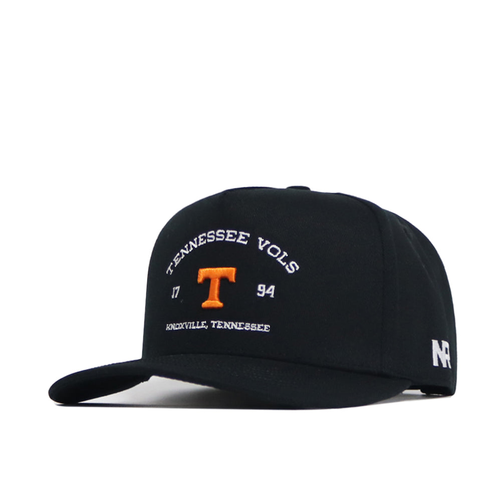 The Tennessee Outlaw Hat - Black by No Rivals is a black snapback cap with "TENNESSEE VOLS" and "1794" in white, an orange T in the center, and "KNOXVILLE, TENNESSEE" below. An official New Era logo is embroidered on the left side.