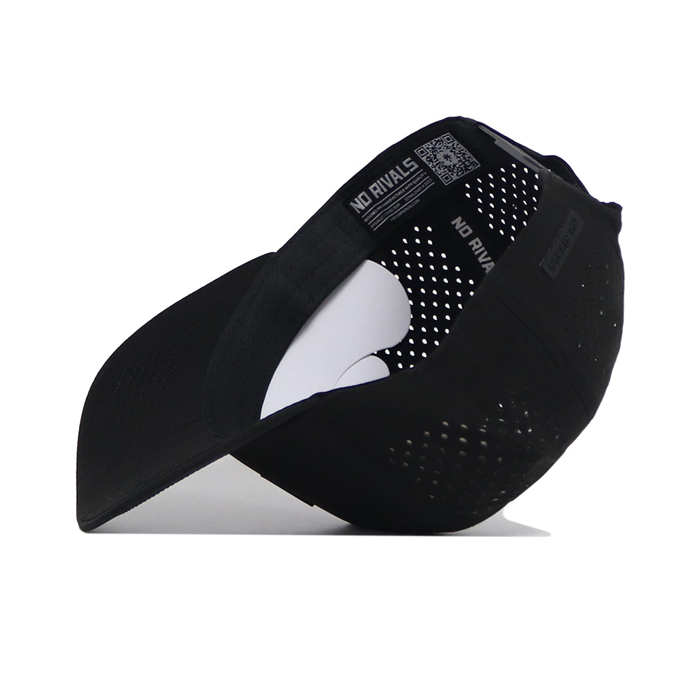 The No Rivals Tennessee Trainer Hat is pictured upside down, revealing its inner lining with ventilation holes, "NO RIVALS" text on the sweatband, performance blend fabric, a curved brim, and an inside tag.